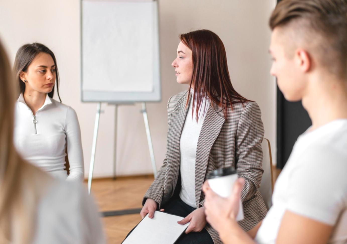 Person reviewing investment documents and charts in a comfortable workspace